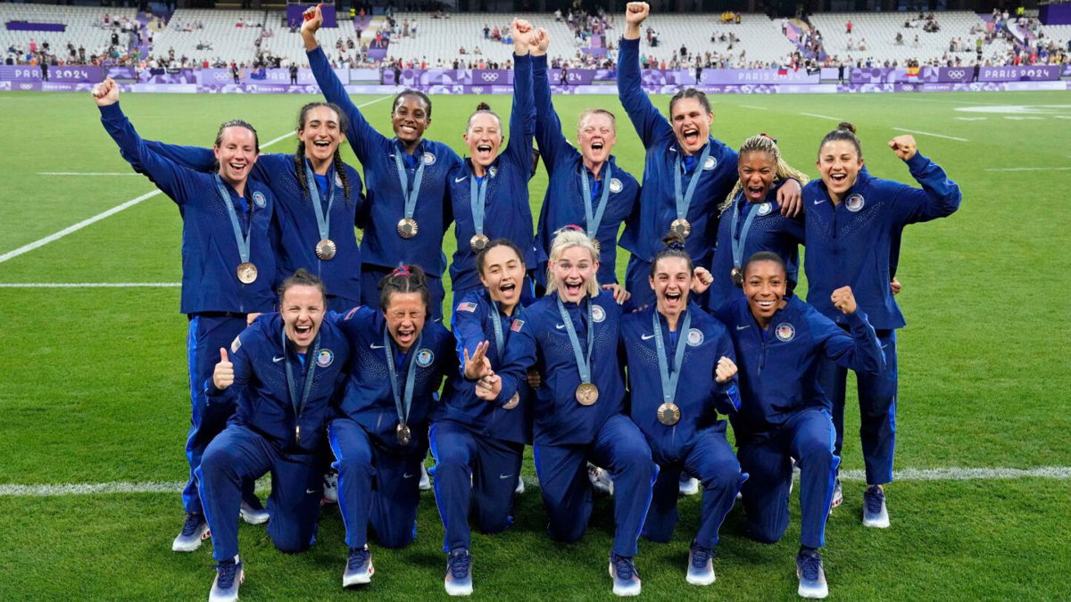 The United States celebrates its bronze medal during the women's rugby sevens medal ceremony at the Paris 2024 Olympic Games at Stade de France.