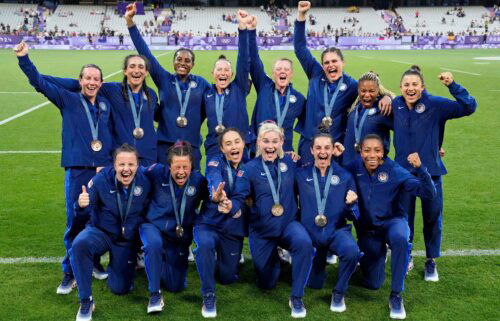 The United States celebrates its bronze medal during the women's rugby sevens medal ceremony at the Paris 2024 Olympic Games at Stade de France.