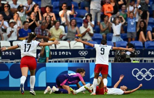 Players from the U.S. celebrate after Sophia Smith scored in the 95th minute during the women's semifinal match between the United States and Germany during the Paris Olympics at the Lyon Stadium on August 6