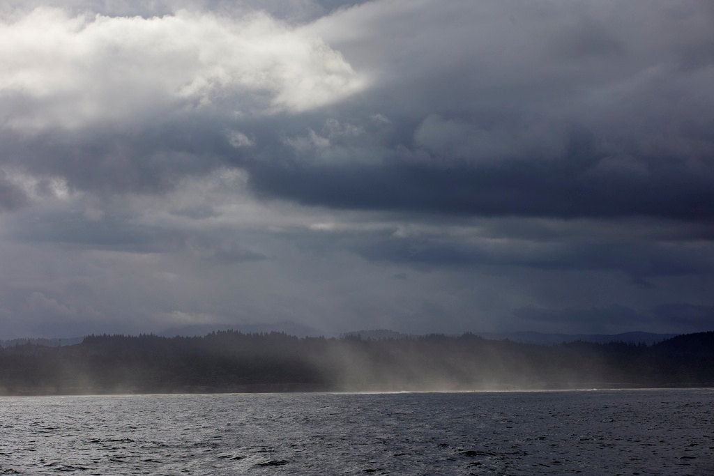 The area around the city of Newport is seen from the Pacific Ocean near the PacWave South wave energy test site, Friday, Aug. 23, 2024. The coastal waters of Oregon are shaping up to be key for advances in two forms of renewable energy: wave power and wind turbines that float. 