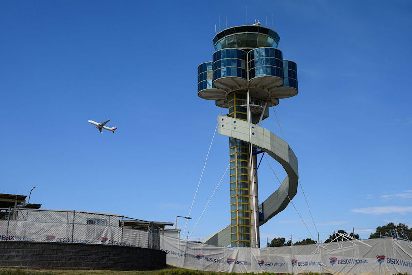 A plane leaves Sydney Airport in Australia.