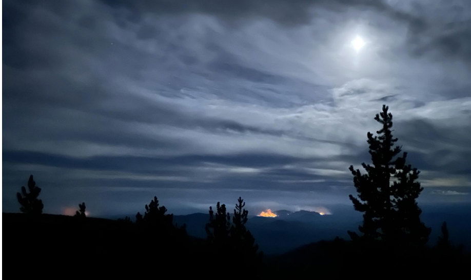 nighttime glow of the Flat Top Fire as seen from the road to Paulina Peak, Saturday, September 14,