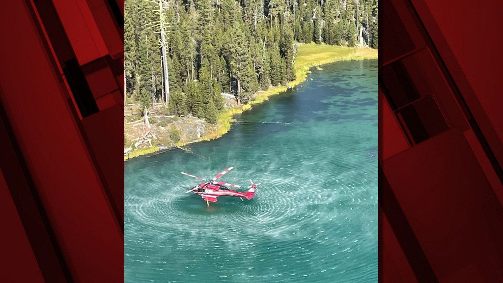 Helicopter draws water to help battle the Little Lava Fire on the Deschutes National Forest.