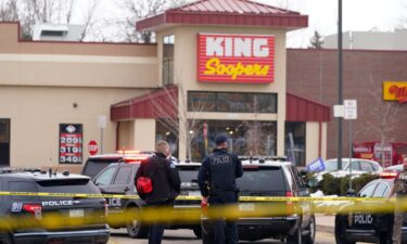 Police stand outside a King Soopers grocery store in  Colorado after shooting on March 22