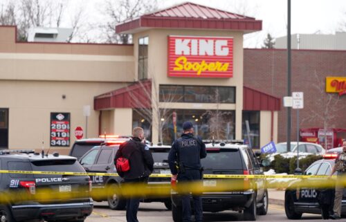 Police stand outside a King Soopers grocery store in  Colorado after shooting on March 22