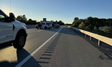 Authorities block traffic on Interstate 75 in Kentucky on Saturday.