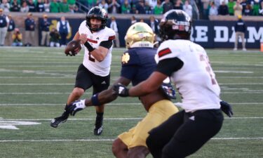 Northern Illinois quarterback Ethan Hampton (2) runs with the ball against Notre Dame.