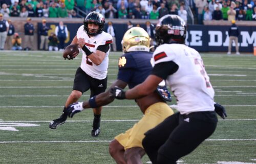 Northern Illinois quarterback Ethan Hampton (2) runs with the ball against Notre Dame.