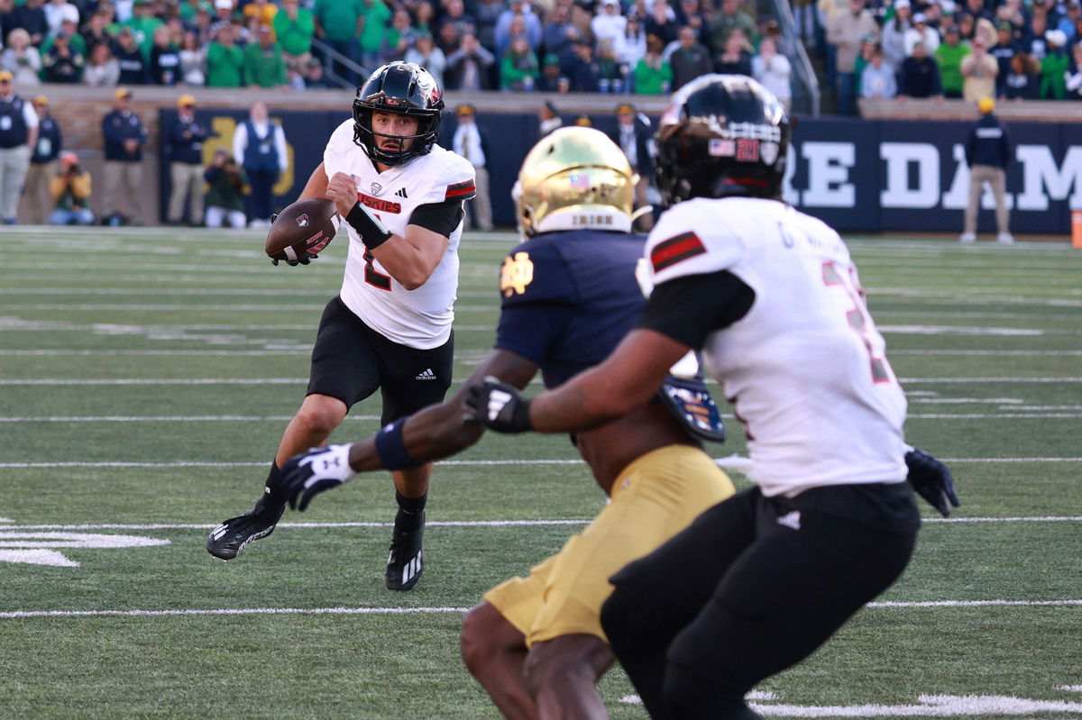 <i>Brian Spurlock/Icon Sportswire/AP via CNN Newsource</i><br/>Northern Illinois quarterback Ethan Hampton (2) runs with the ball against Notre Dame.