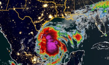 An infrared satellite image shows Potential Tropical Cyclone Six churning in the western Gulf of Mexico early Monday morning.