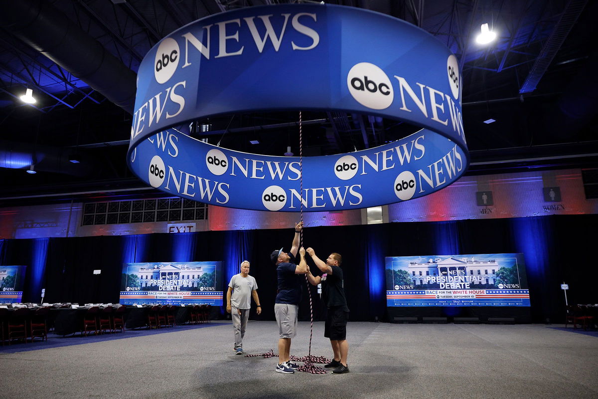 <i>Chip Somodevilla/Getty Images via CNN Newsource</i><br/>ABC News signage is installed inside the Pennsylvania Convention Center ahead of the September 10 presidential debate in Philadelphia.