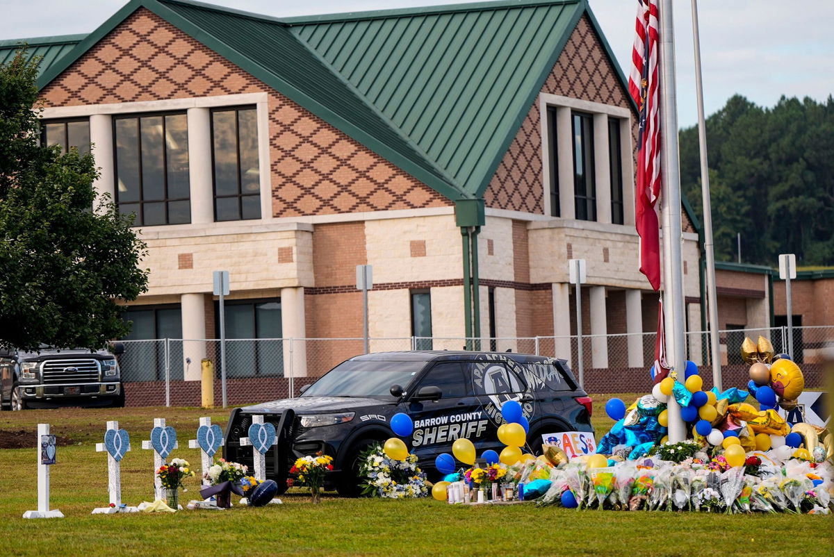 <i>Mike Stewart/AP via CNN Newsource</i><br/>A memorial now sits outside Apalachee High School in Winder