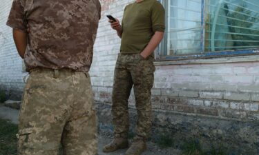 A group of Ukrainian soldiers rest in a village near the Russian border after taking part in Ukraine’s operation in Kursk.