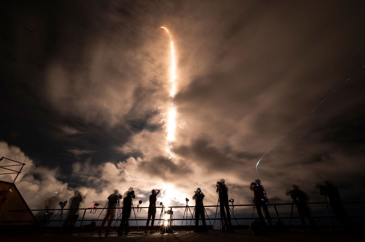 <i>Chandan Khanna/AFP/Getty Images via CNN Newsource</i><br/>A SpaceX Falcon 9 rocket with the Crew Dragon Resilience capsule