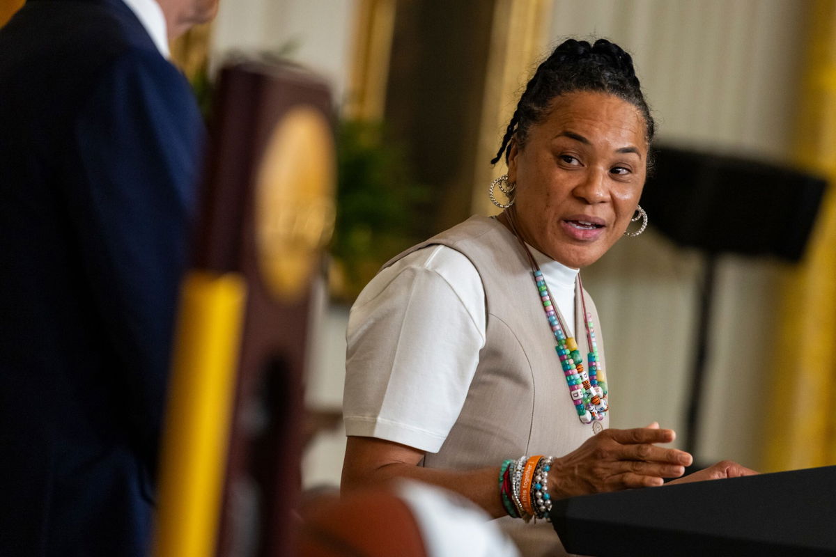 <i>Samuel Corum/Sipa/AP via CNN Newsource</i><br/>University of South Carolina's women's basketball head coach Dawn Staley addresses President Biden.