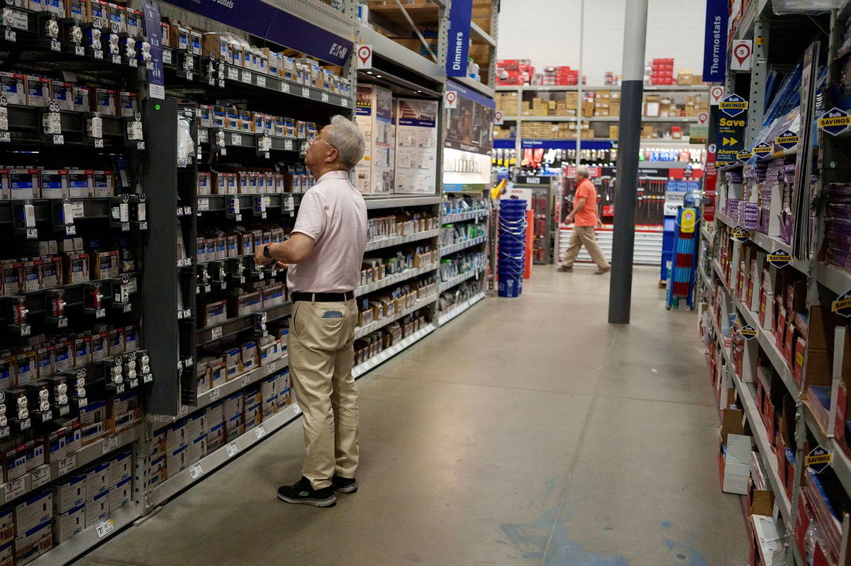 <i>Eric Thayer/Getty Images via CNN Newsource</i><br/>A customer shops in a Lowe's home improvement store in Los Angeles on August 20.