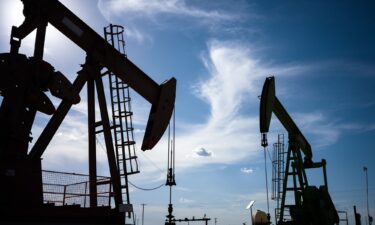 Oil pump jacks are shown in a field on June 27