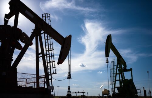 Oil pump jacks are shown in a field on June 27