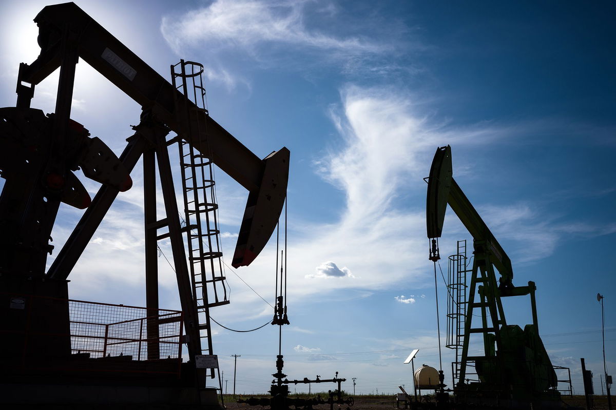 <i>Brandon Bell/Getty Images via CNN Newsource</i><br/>Oil pump jacks are shown in a field on June 27