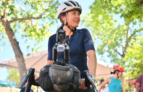 Lael Wilcox prepares to resume riding after taking a break in the Santa Fe Plaza on September 4.