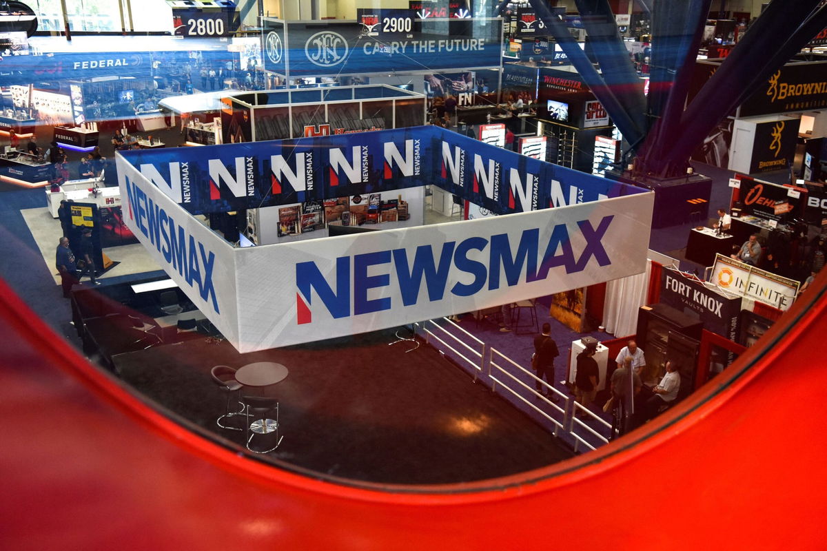 <i>Callaghan O'Hare/Reuters via CNN Newsource</i><br/>A Newsmax booth broadcasts at the National Rifle Association annual convention in Houston on May 29