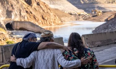 Tribal members hug as crews took down what was left of Iron Gate Dam on the Klamath River. A coalition of tribes