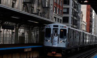 An elevated train moves along the tracks on August 16