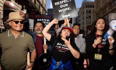 A group marches in support of hotel workers near San Francisco's Union Square on September 2. Hotel union workers are now on strike at hotels across 9 US cities.