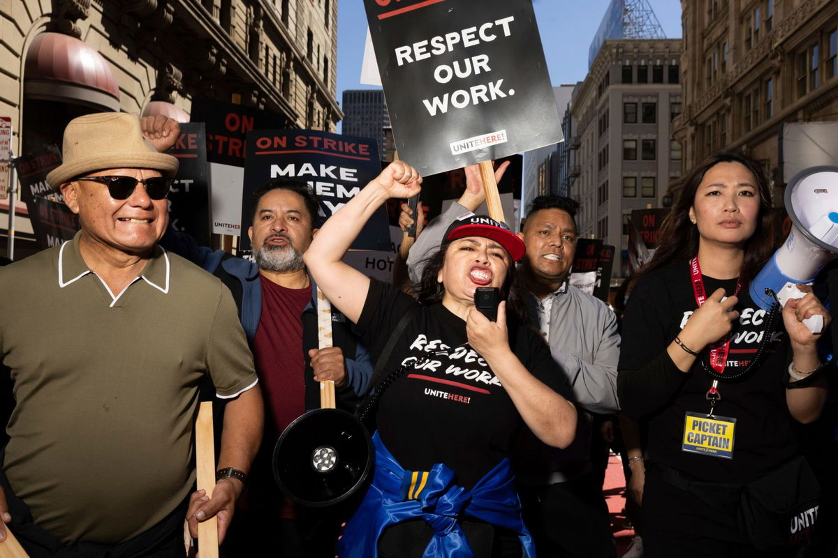 <i>Benjamin Fanjoy/AP via CNN Newsource</i><br/>A group marches in support of hotel workers near San Francisco's Union Square on September 2. Hotel union workers are now on strike at hotels across 9 US cities.