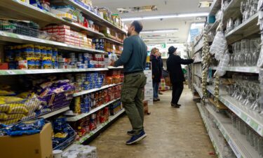 Consumers purchase products at a Dollar Tree store on March 13 in New York City. After years of prolific growth