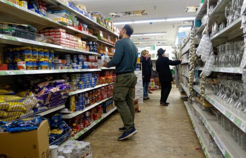 Consumers purchase products at a Dollar Tree store on March 13 in New York City. After years of prolific growth