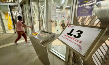 Windows and doors are taped as Hong Kong braces for the arrival of Typhoon Yagi.