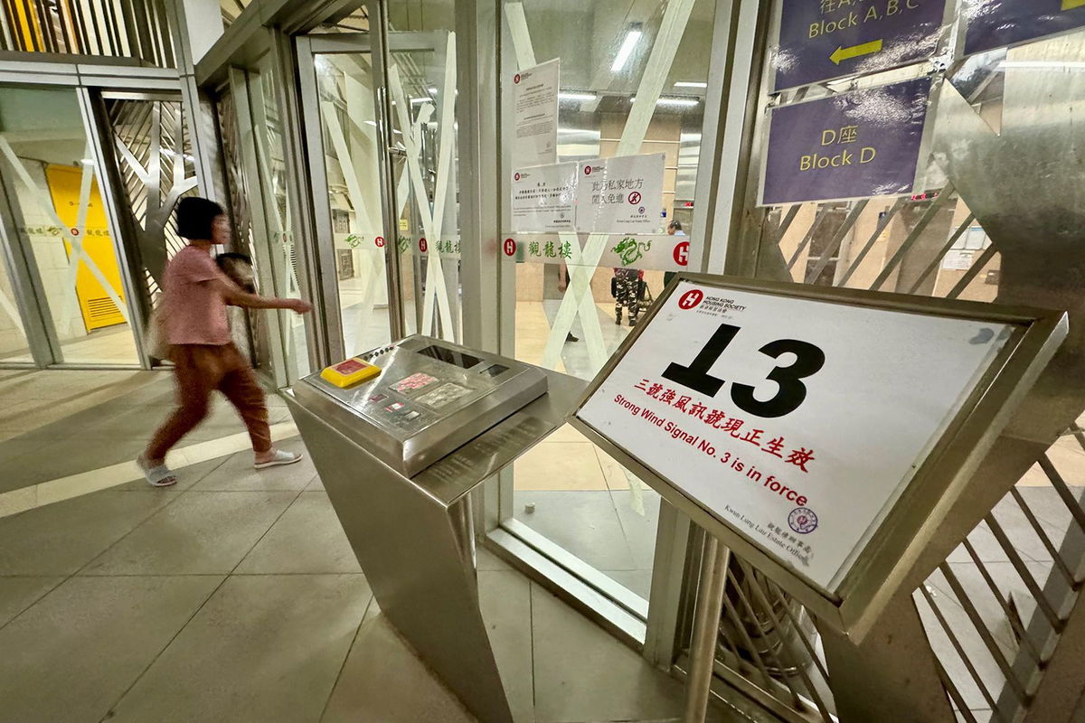 <i>Li Zhihua/China News Service/VCG/Getty Images via CNN Newsource</i><br/>Windows and doors are taped as Hong Kong braces for the arrival of Typhoon Yagi.