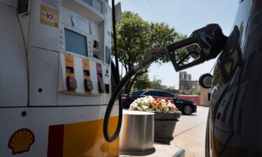 A customer purchases gas at a station on June 11