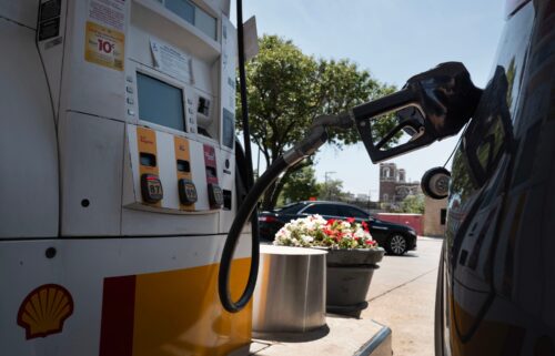 A customer purchases gas at a station on June 11