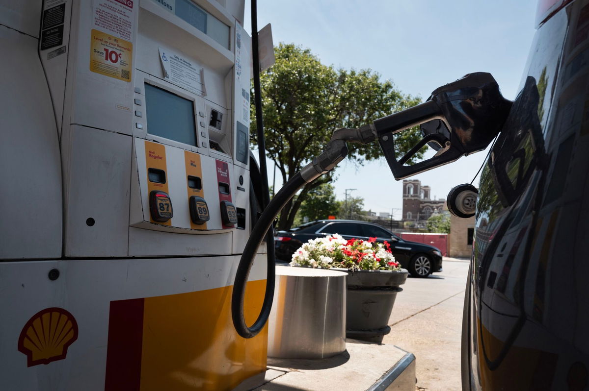 <i>Scott Olson/Getty Images via CNN Newsource</i><br/>A customer purchases gas at a station on June 11