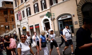 A pharmacy sign displays a temperature of 41 degrees Celsius (105.8 Fahrenheit) at the Spanish Steps amid a heatwave