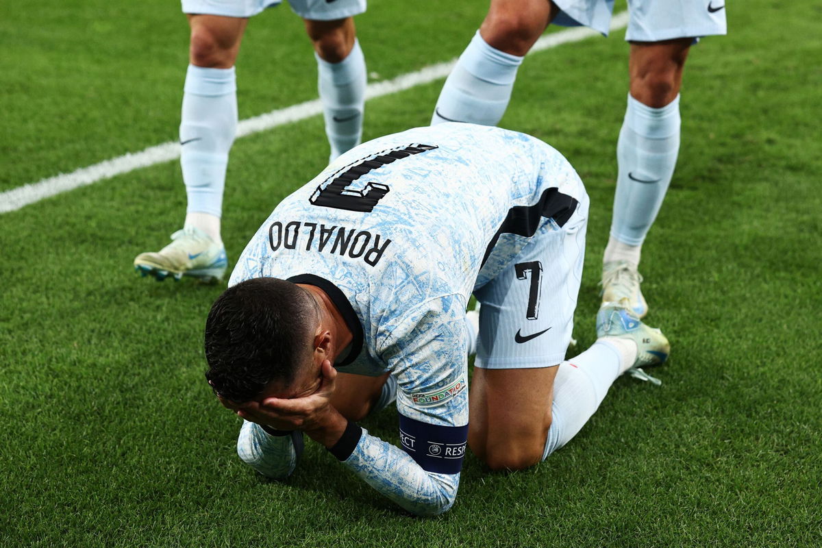 <i>Carlos Rodrigues/UEFA/Getty Images via CNN Newsource</i><br/>Cristiano Ronaldo is overcome with emotion after scoring his 900th career goal.