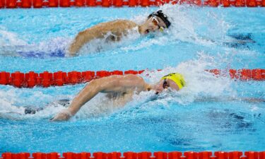 Australia's Sam Short and Korea's Kim Woo-min (top) compete in the 400-meter freestyle heats in Paris.