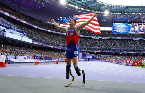 Team USA's Hunter Woodhall celebrates after winning gold at the Paris 2024 Paralympics.