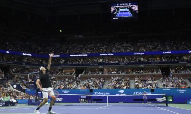 Taylor Fritz serves against Frances Tiafoe during their semifinal.