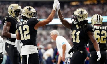 Alvin Kamara (right) scored four touchdowns as the New Orleans Saints beat the Dallas Cowboys.