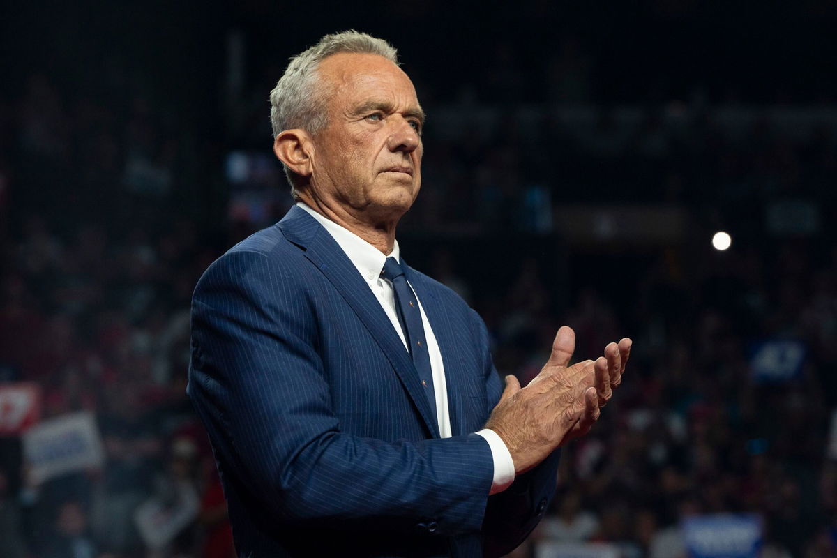 <i>Rebecca Noble/Getty Images via CNN Newsource</i><br/>Robert F. Kennedy Jr. listens during a campaign rally for former President Donald Trump at the Desert Diamond Arena on August 23