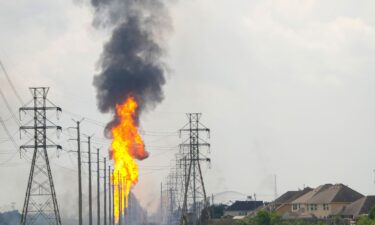 Flames burn from a pipeline along Spencer Highway in La Porte on September 16.