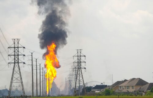 Flames burn from a pipeline along Spencer Highway in La Porte on September 16.