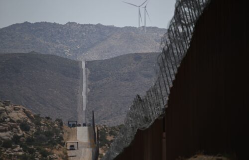 US Customs and Border Protection Border Patrol vehicles sit parked along fencing between the United States and Mexico on August 1 in Jacumba Hot Springs