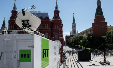 Vehicles of Russian state-controlled broadcaster Russia Today (RT) are seen near the Red Square in central Moscow