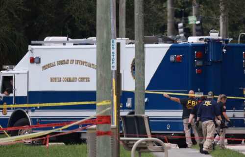 Law enforcement personnel continue to investigate the area around Trump International Golf Club after an apparent assassination attempt on former President Donald Trump on September 16 in West Palm Beach