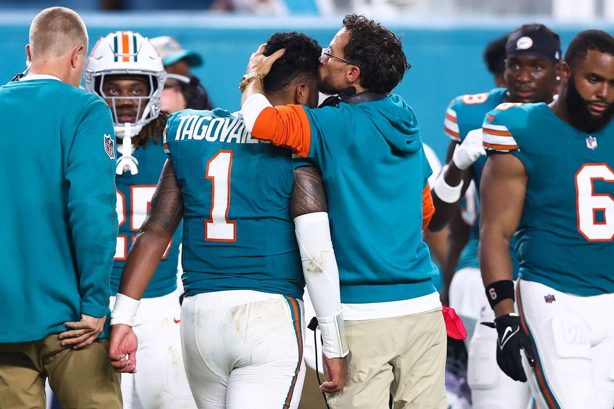 <i>Megan Briggs/Getty Images via CNN Newsource</i><br/>McDaniel comforts Tagovailoa after the quarterback's latest concussion.