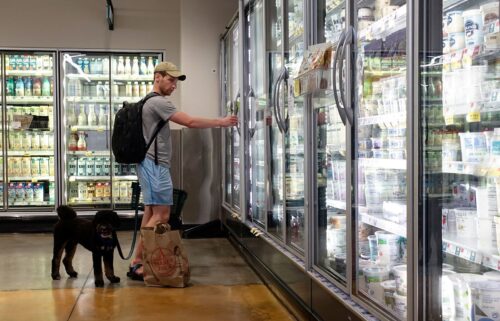 A customer shops for dairy products at a supermarket in Manhattan on July 11 in New York City.